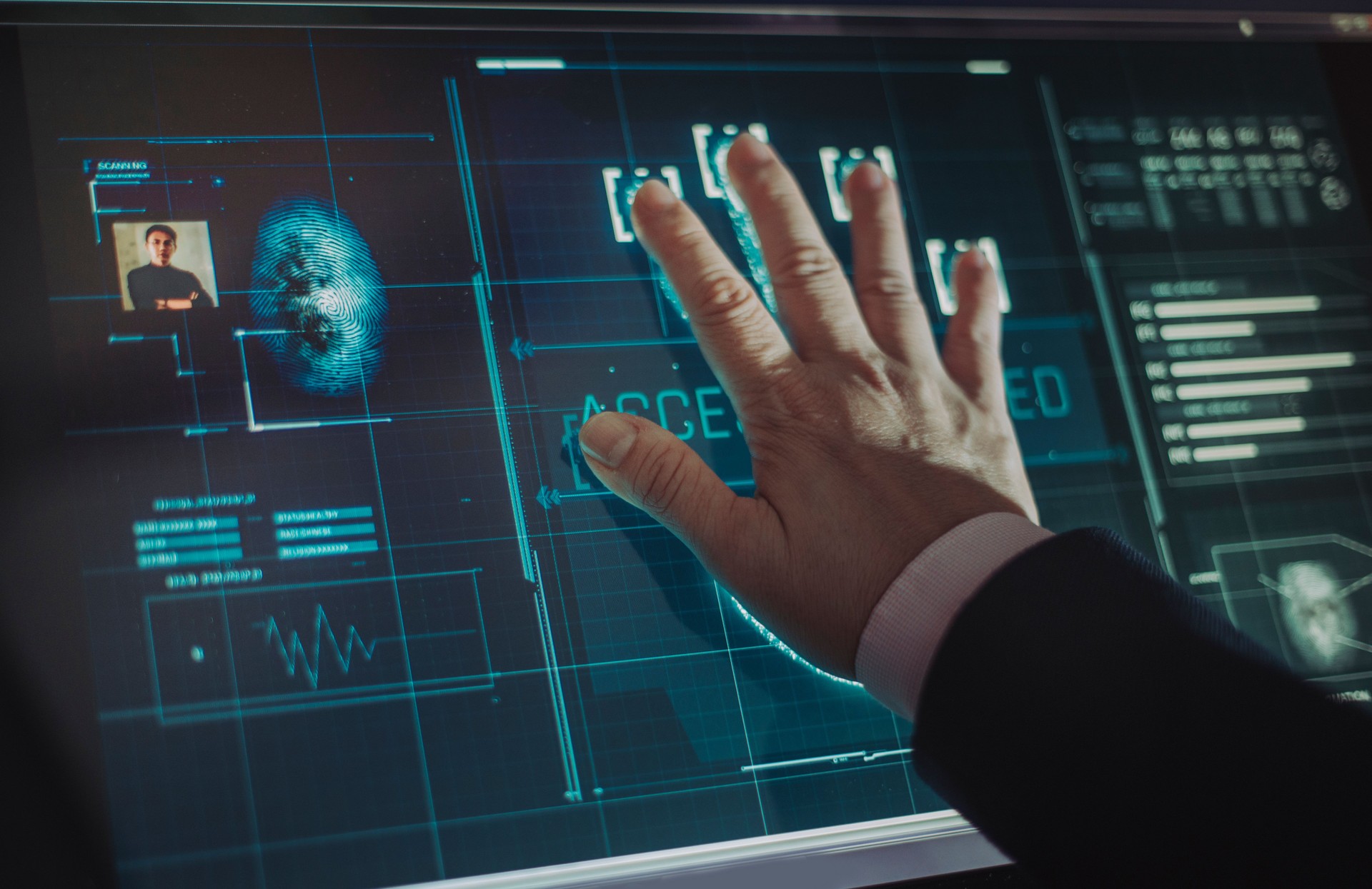 hand of asian chinese with blazer put on scanner device screen for security check access